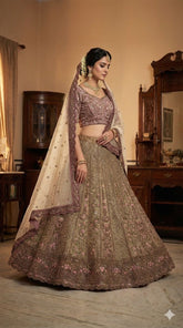 Woman in traditional Indian attire standing in a room with wooden furniture.