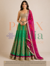 Woman wearing a green lehenga and pink dupatta with a beige background
