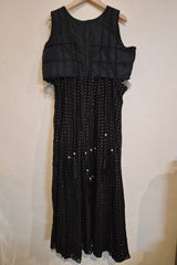 Black dress with bead detailing on a white background