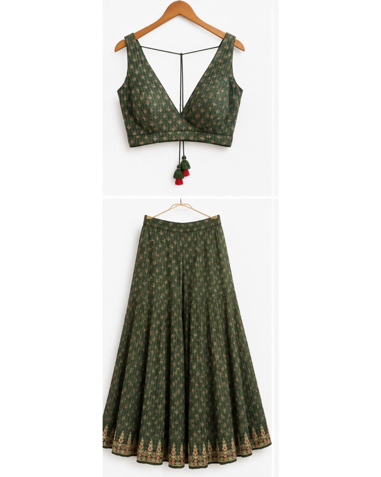 A two-piece women's outfit set featuring a dark green sleeveless crop top with a deep V-neckline and tassel detail, paired with a matching flared skirt that has a gold border print, both displayed on wooden hangers against a white background.