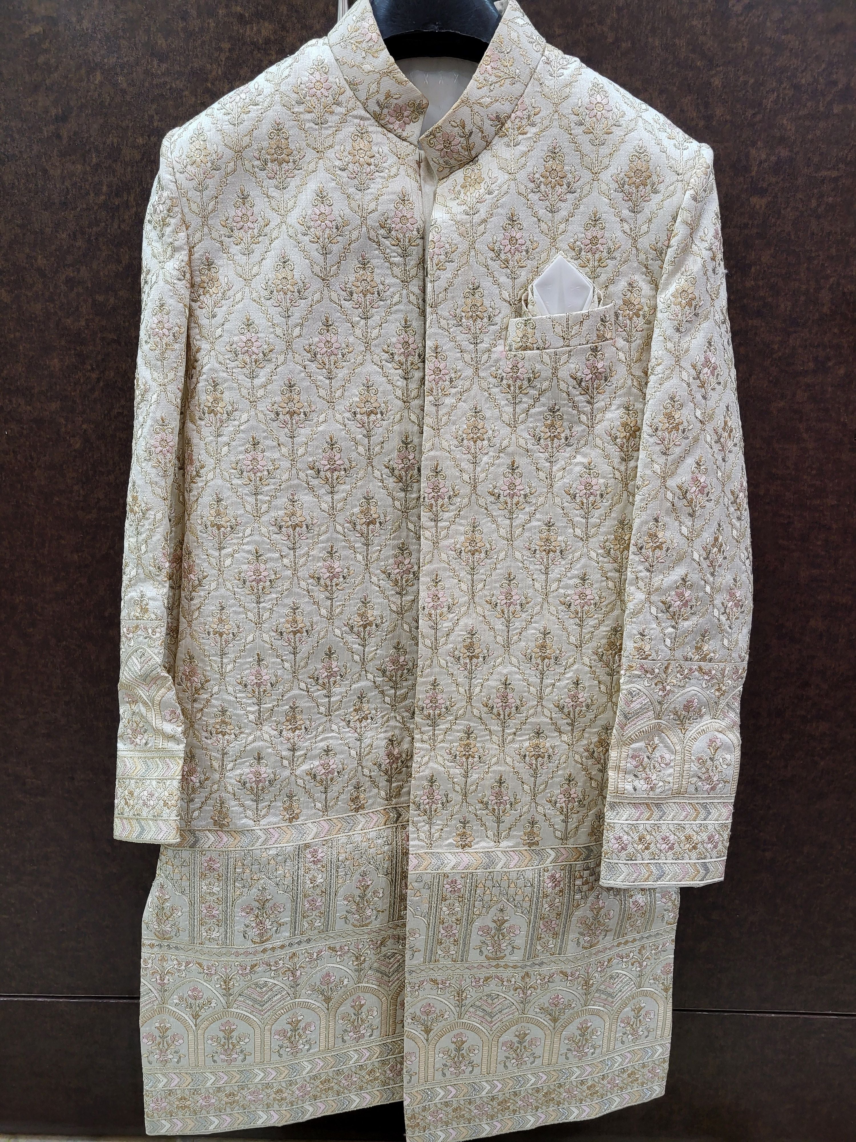 Traditional embroidered sherwani on a dark background