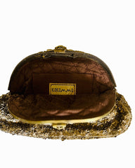 Gold and brown handbag with 'Kokommo' label on a white background