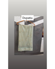 A sage green dupatta with delicate gold floral embroidery and a matching embroidered border, hanging on a wooden hanger against a dark gray paneled wall.