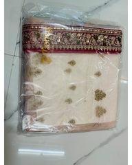 A folded light-colored fabric piece, likely a dupatta or scarf, packaged in a clear plastic bag. The fabric features a wide maroon border with intricate gold and silver floral embroidery, and scattered gold sequin embellishments on the light body.