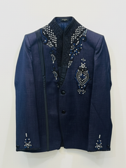 Navy blue blazer with intricate beadwork on a white background