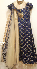 Blue and gold embroidered traditional outfit with a white dupatta on a white background