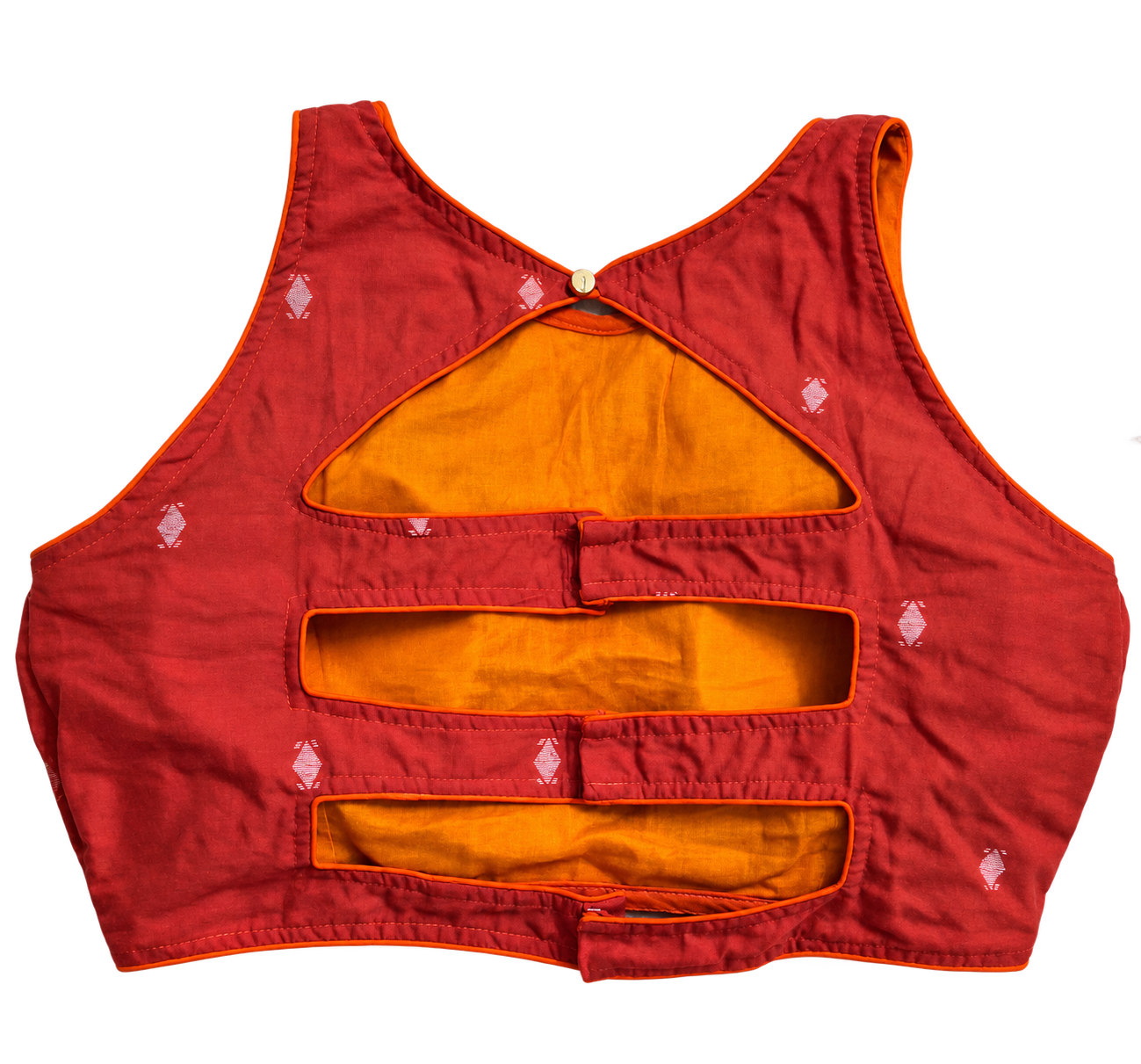 An orange sleeveless cotton Jamdani blouse with multiple horizontal cutouts and a small gold button at the back neckline, featuring small white embroidered motifs, shown against a plain white background.