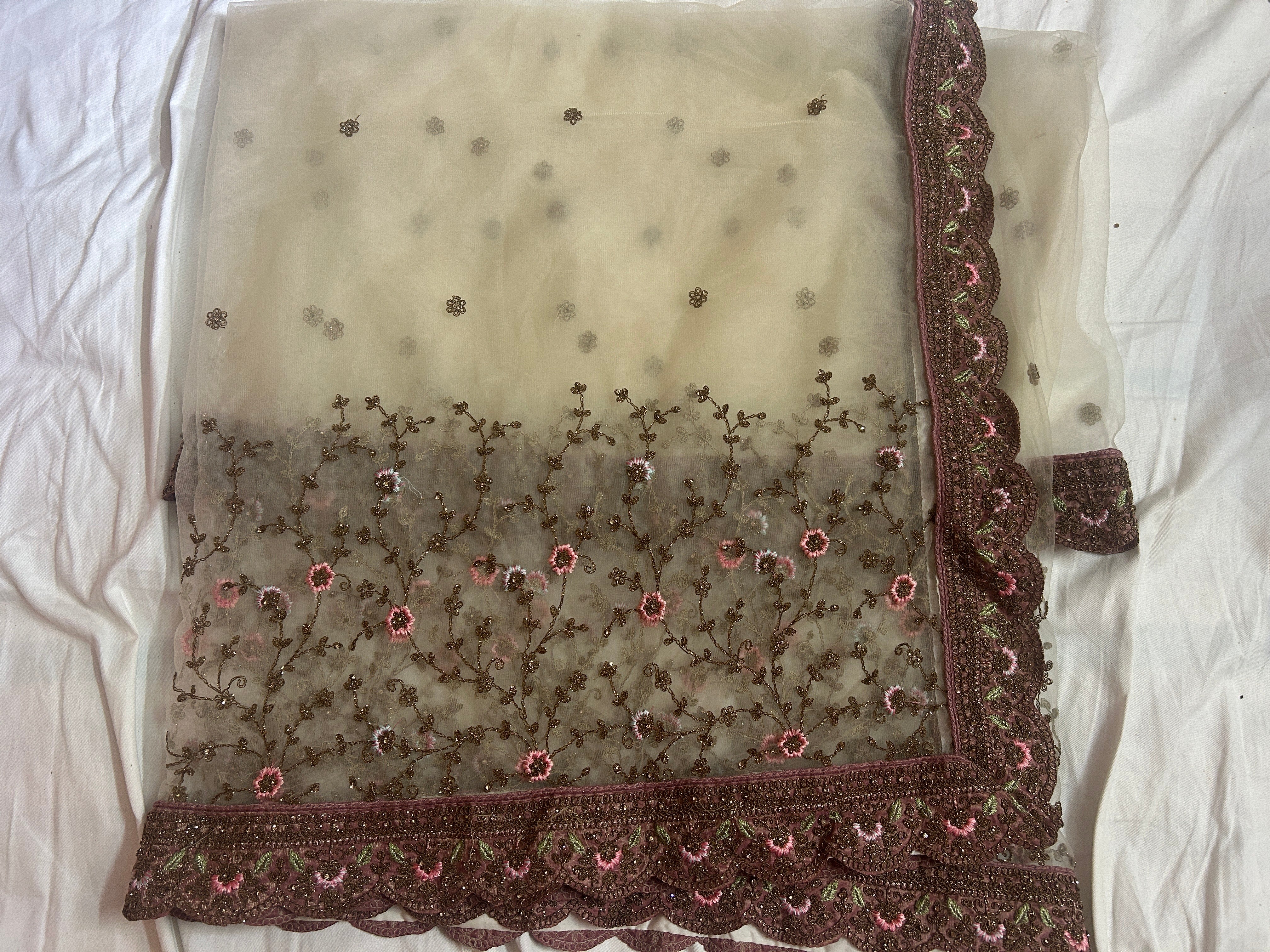 Embroidered dupatta with floral patterns on a white background