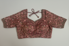 Floral patterned choli top on a light gray background