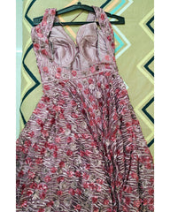 Floral dress on a hanger against a geometric patterned wall