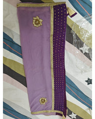 Purple dupatta with gold border and floral patterns on a striped fabric background