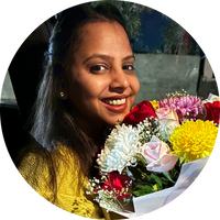 Woman holding a bouquet of flowers with a blurred background