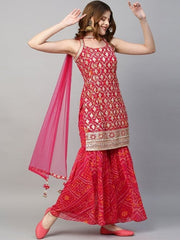 Woman wearing a red traditional outfit with gold patterns on a gray background